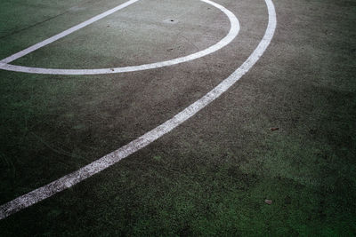 White lines on green basketball court