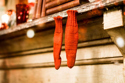 Low angle view of decorations hanging outside house 