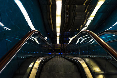 High angle view of escalator in illuminated building