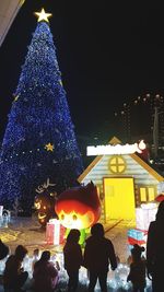 Illuminated christmas tree at night