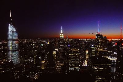 Illuminated buildings in city at night