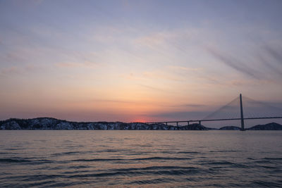 View of suspension bridge over sea