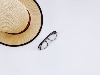 High angle view of hat on table against white background