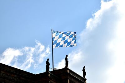 Low angle view of statue against blue sky