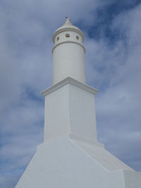 Low angle view of bell tower against sky