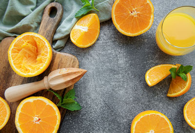 Glass of fresh orange juice with fresh fruits