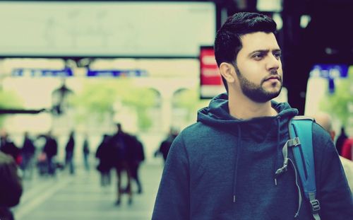 Young man looking away outdoors