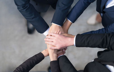Low section of people with hands