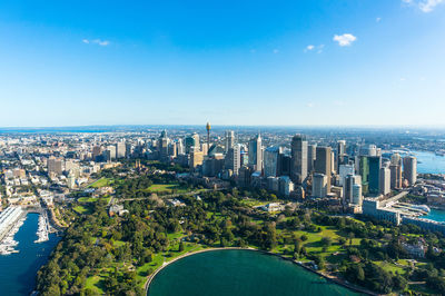 High angle view of city against blue sky