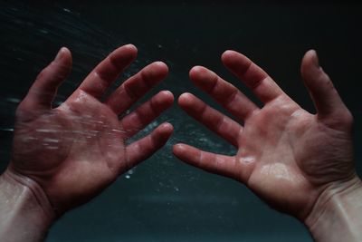 Close-up of hands touching baby hand