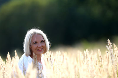 Portrait of a smiling young woman standing outdoors