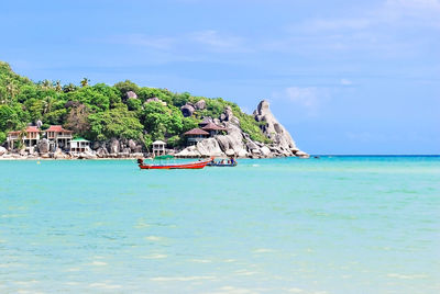 Scenic view of sea against blue sky