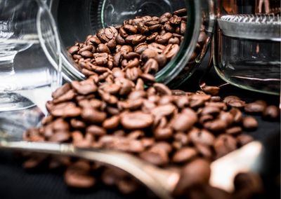 Close-up of roasted coffee beans in plate