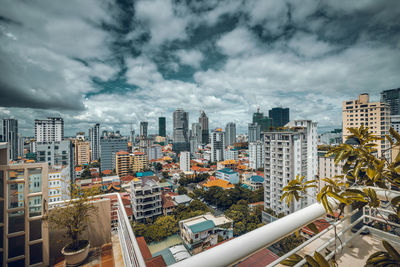 High angle view of buildings in city against sky