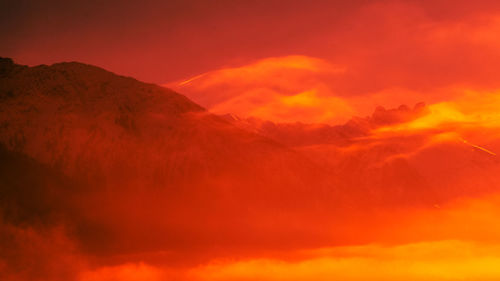 Low angle view of dramatic sky during sunset