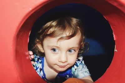 Close-up of cute baby girl in outdoors play equipment