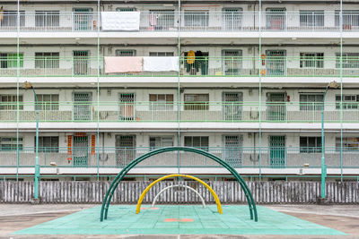 Full frame shot of building by swimming pool in city