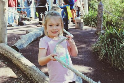 Portrait of happy girl playing on outdoors