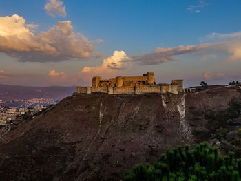 Scenic view of a castle against sky during sunset