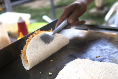 Close-up of hand holding food