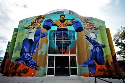 Low angle view of man standing against built structure