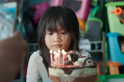 Girl looking at cake