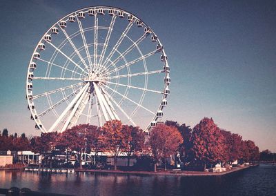 Ferris wheel against clear blue sky