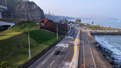 High angle view of road by mountain against sky