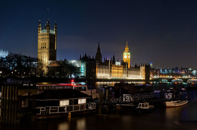 Illuminated buildings in city at night