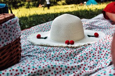 Close-up of hat on grass in field