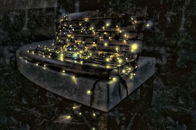 High angle view of illuminated candles on wall