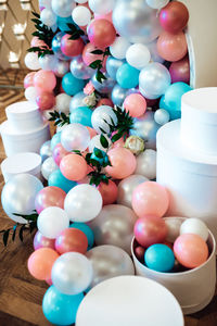 High angle view of multi colored balloons on table