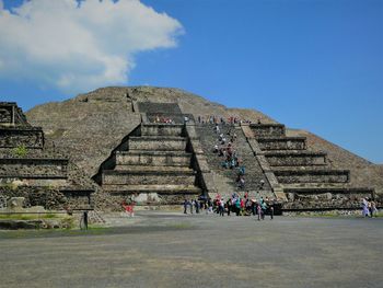 Group of people in front of historical building-pyramid