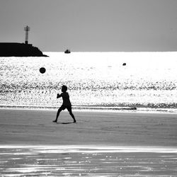 Woman standing on beach