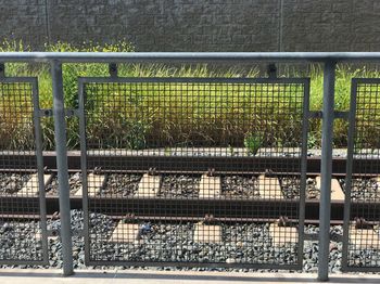 High angle view of metal grate on railroad track