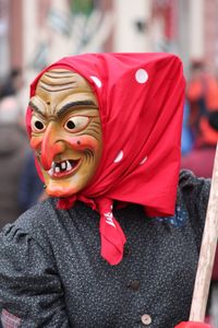 Close-up of person wearing mask while standing outdoors