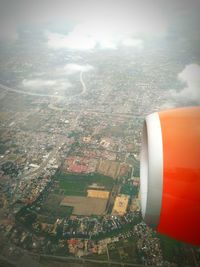 Aerial view of illuminated cityscape against sky