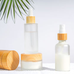 High angle view of bottles on white background