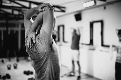 Side view of man exercising in gym