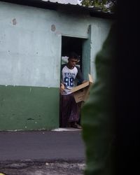 Man standing in front of building