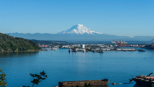 A view
 of the port of tacoma and mount rainier.