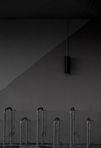 Low angle view of illuminated lamp on wall