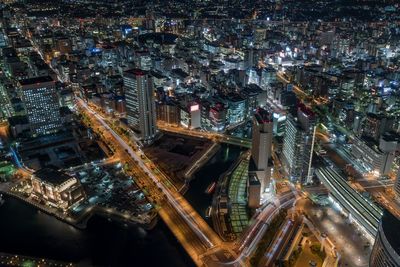 High angle view of city lit up at night