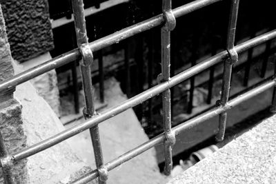 Close-up of railing by water