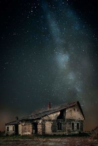 Low angle view of old building against sky at night