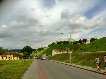 View of road against cloudy sky