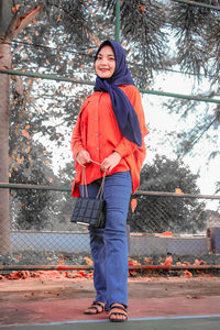 Portrait of smiling girl standing in winter