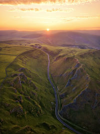 Aerial view of landscape against sky during sunset