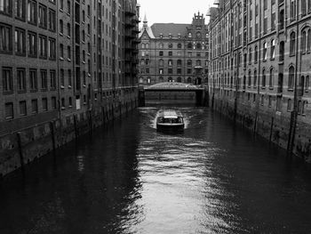 Canal amidst buildings in city