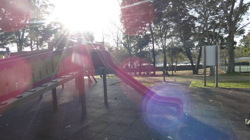 View of playground against trees in park